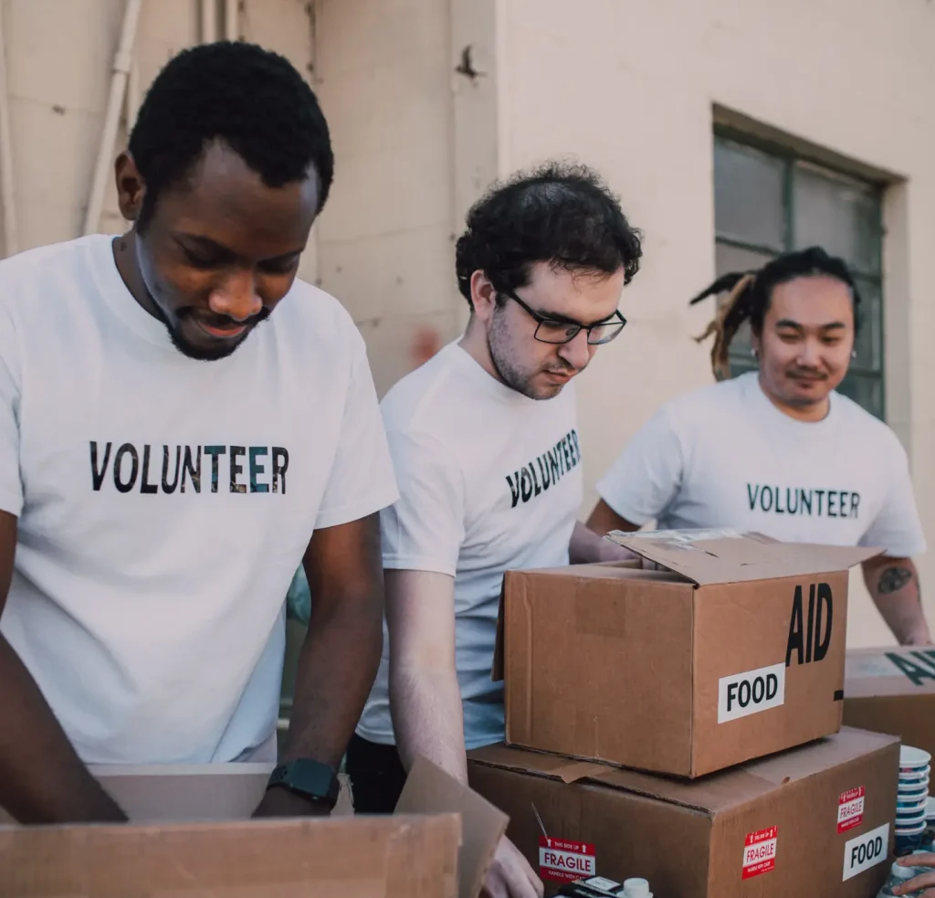 Volunteers at a nonprofit filling food boxes