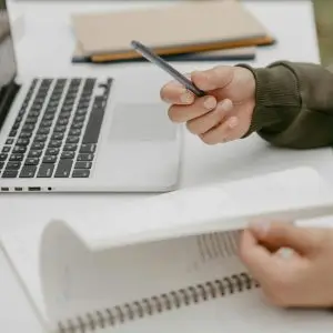 Ideating content and storytelling on a notebook and computer